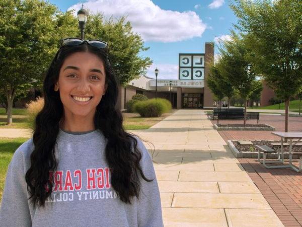 Student on the mall smiling